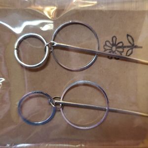 Cute earrings. 2 circles and a bar hanging from their middle. These are so fun.